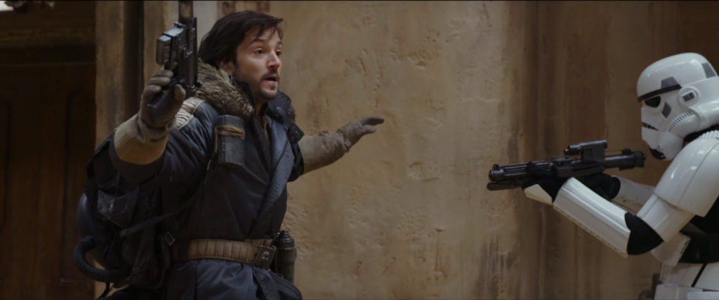 Cassian Andor (Diego Luna) held up by a Storm Trooper