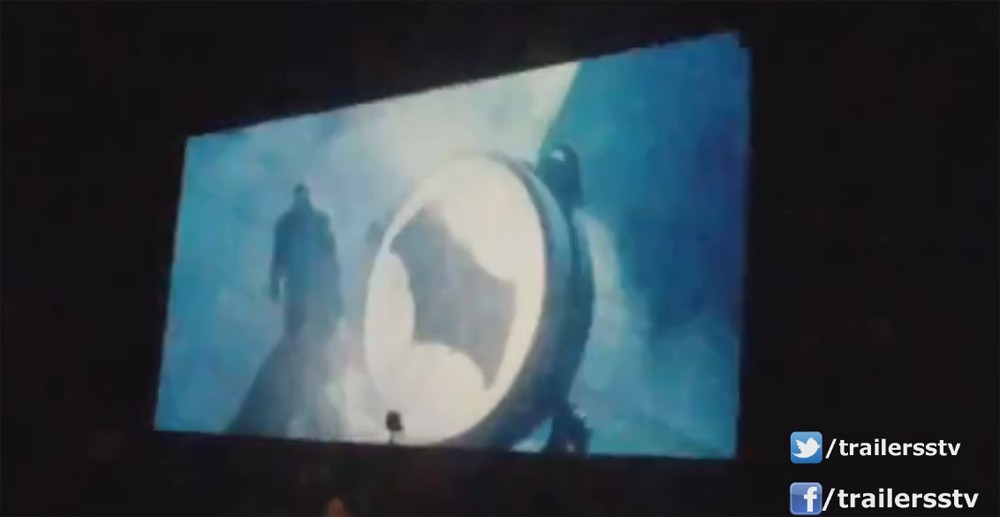 Batman is seen opening up the Bat-Signal (most likely on top of Gotham).