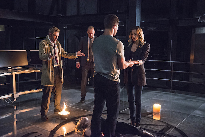 Arrow -- "Haunted" -- Image AR404B_0027b.jpg -- Pictured (L-R) Matt Ryan as Constantine, Paul Blackthorne as Detective Quentin Lance, Stephen Amell as Oliver Queen and Katie Cassidy as Laurel Lance -- Photo: Cate Cameron/ The CW -- ÃÂ© 2015 The CW Network, LLC. All Rights Reserved.